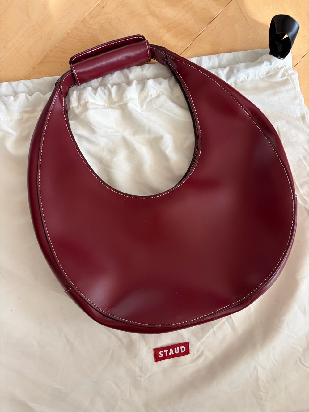 STAUD Crescent Shoulder Bag in Burgundy Red